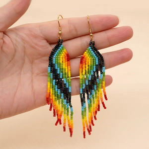 Colorful rainbow beaded tassel earrings with bohemian fringe design and gold hooks