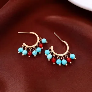 Vintage 14K gold plated C-shaped earrings with blue and red agate bead pendants