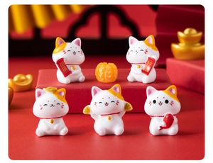 Set of 5 lucky cat resin figurines with golden ingots and pumpkin on festive red background