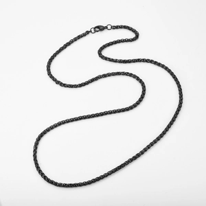 Detail of matte black wheat chain necklace with lobster clasp in stainless steel finish