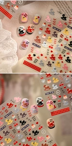 Close-up of retro nail art stickers with rocking horse and colorful plaid bow designs