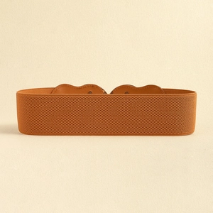 Close-up of brown elastic corset belt with leather finish and metal ring details