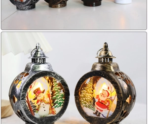Detail of Santa and Snowman LED lanterns with warm vintage metallic finish