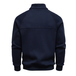 Back view of men's dark blue ribbed knit jacket with high collar and sleek silhouette