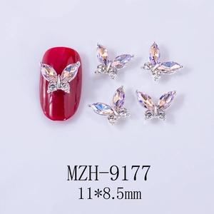 Detailed macro view of aurora purple marquise crystal butterfly nail art charms with dimensions