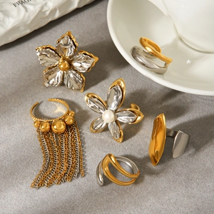 Two-tone stainless steel ring set featuring floral motifs and elegant chain tassels