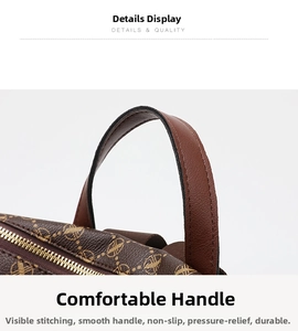 Detail of the brown monogram leather handle with gold zipper and stitching