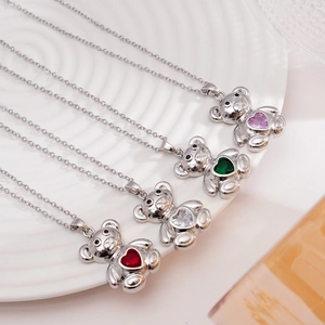 Gold plated bear necklaces with colorful heart zircon pendants in red, green, and purple