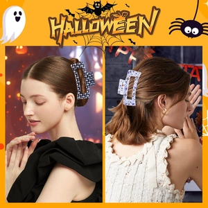Detail of square Halloween hair claws featuring spooky ghosts and pumpkins on a female model
