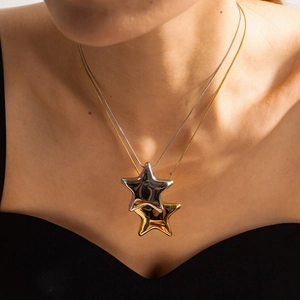 Layered stainless steel necklace with 18K gold and silver star pendants for women