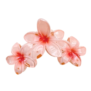 Pink and orange gradient frangipani flower hair claw clip with a glossy resin finish