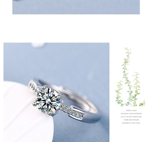 Detailed view of silver ring featuring a four-prong set cubic zirconia and pavé band