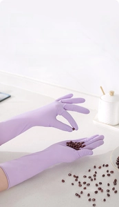 Detail of purple nitrile gloves showing textured fingertips for anti-slip grip and precision