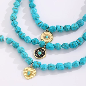 Bohemian turquoise beaded necklaces with evil eye and sun charms in gold plating