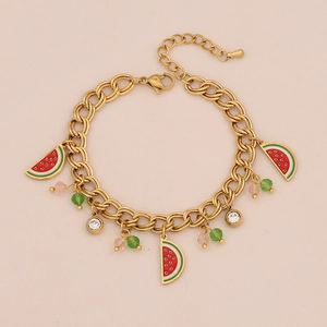 Detail of gold chain necklace featuring colorful watermelon charms and faceted beads