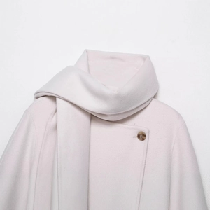 Minimalist light pink wool blend coat with matching scarf and amber button closure