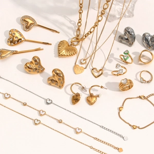 18K gold and silver heart-shaped jewelry set with necklaces, earrings, and rings