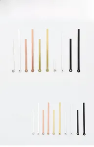 Macro detail of model 1073 minimalist aluminum clock hands in various colors and sizes