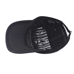 Detail view of cotton baseball cap interior featuring a black woven 100% cotton wash label