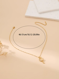 Detailed close-up of a gold stainless steel necklace featuring a moon and star zircon pendant