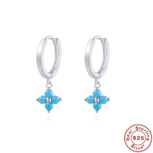 Detail of S925 sterling silver four-leaf clover drop earrings with sky blue crystal stones