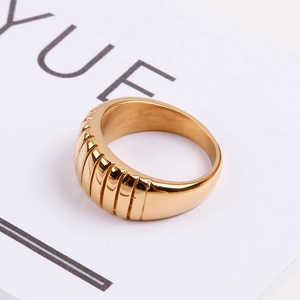 Fashionable French croissant style gold stainless steel ring with vertical striped texture