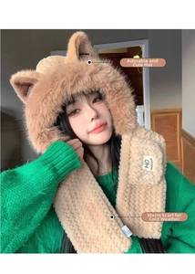 Close-up of plush fox ear hat and scarf set with HO letter patch and faux fur trim
