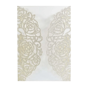 Detailed close-up of a silver glitter laser-cut rose hollow wedding invitation card