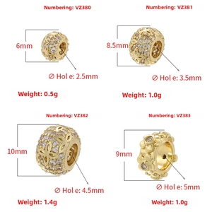 Macro detail of four gold镂空 beads with sizes and weights for DIY jewelry design