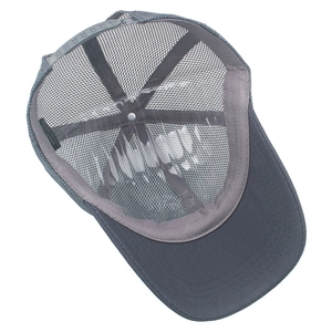 Detail view of cotton and polyester blend label inside a mesh trucker baseball cap