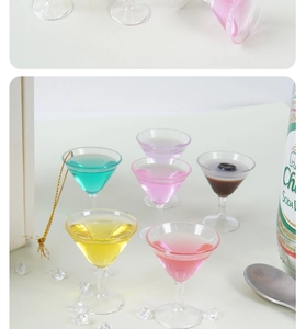 Macro view of six colorful miniature cocktail martini glasses with realistic liquid inside