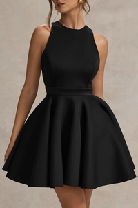 Macro detail of elegant black cocktail dress showing a-line silhouette and high neck fabric texture