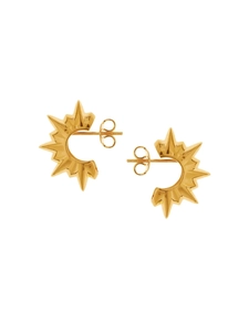 Detailed macro view of 18K gold sunburst C-shaped earrings with a high-shine polished finish