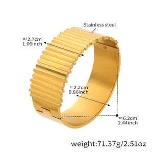 Detailed size view of the 2.7cm wide ridged gold-plated stainless steel cuff bracelet