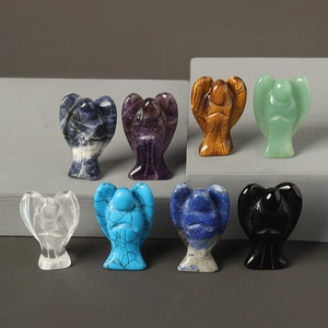 Detailed macro view of eight assorted hand-carved natural crystal angel figurines on a stand