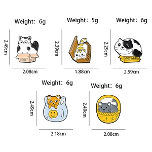 Set of five cute cartoon cat enamel pins in cardboard boxes with size and weight specs