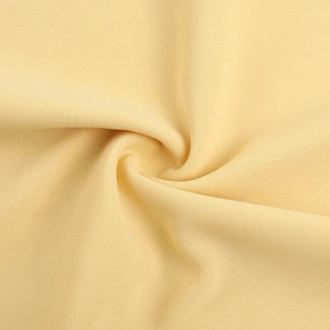 Detail view of the French retro cream sleeveless dress showing premium plain weave fabric texture