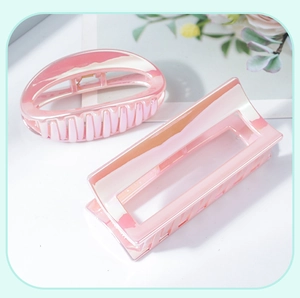 Detailed view of pink mermaid jelly hair claws in oval and rectangular shapes