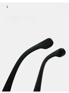 Detail of ergonomic curved mirror legs on black round sunglasses for a comfortable fit