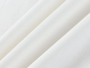 Macro detail of soft white modal fabric showing high-quality stretch texture and stitching