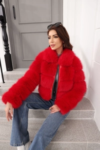 Detailed close-up of vibrant red faux fur jacket for women with premium soft texture