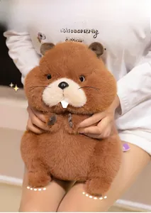 Close-up of a brown marmot plush toy with visible white teeth and thick fluffy fur