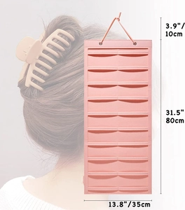 Pink felt hanging wall organizer for hair clips with dimensions 35cm by 80cm