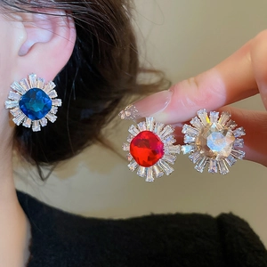 Detailed view of sunflower zircon earrings in blue, red, and white crystal colors