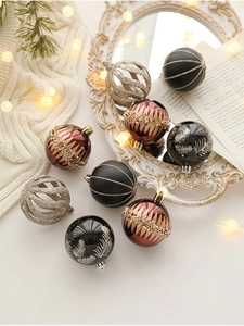 Close-up of matte and glitter Christmas balls with festive holiday lights and decor