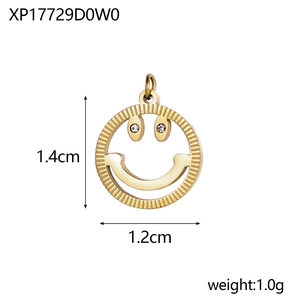 Macro view of gold smiley face pendant with clear rhinestones and 1.4cm size metrics
