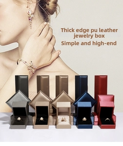 Detailed view of thick-rimmed PU leather ring boxes in five elegant colors with velvet lining