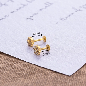 Golden flower labret studs with zircon crystals in 6mm and 8mm sizes for piercings