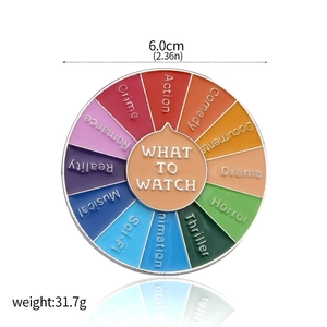 Detail view of rotating enamel movie decision wheel pin showing size and material specs