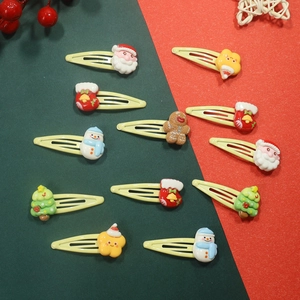 Set of 11 Christmas hair clips with resin Santa, snowman, and tree on red-green background